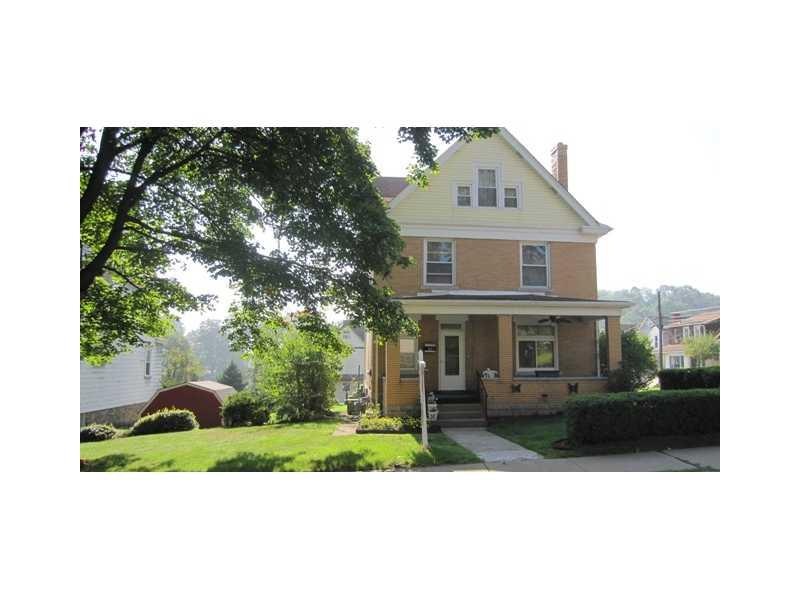 Exterior Front. Situated on a large corner lot, th