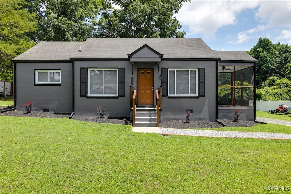 Bungalow-style home with a front yard, stucco sidi