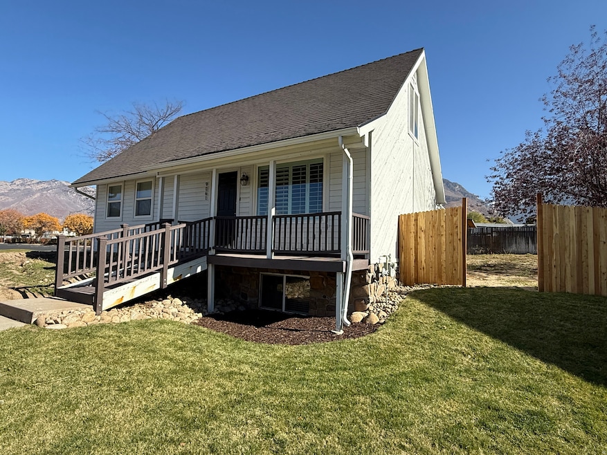 View of front facade featuring a shingled roof and a mountain view