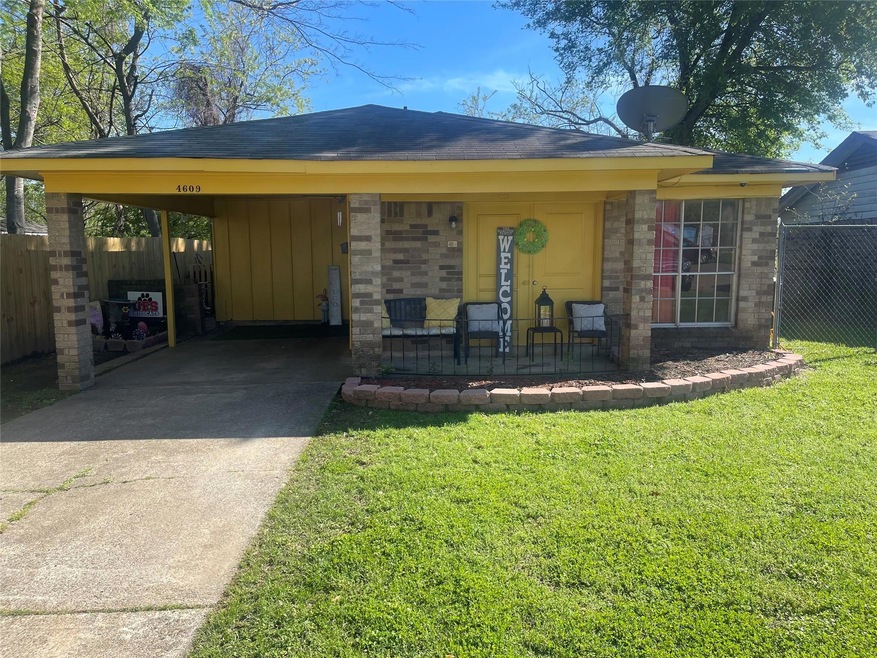 Single story home featuring a front yard and a car