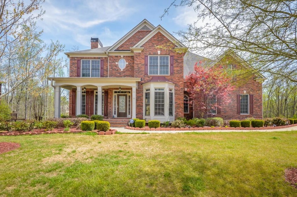 3 Sides brick beauty backs up to undeveloped green