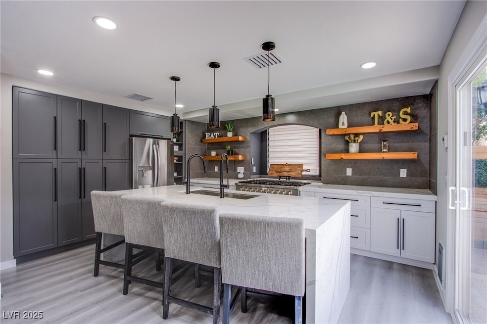 Stunning chef’s kitchen with quartz counters, wate