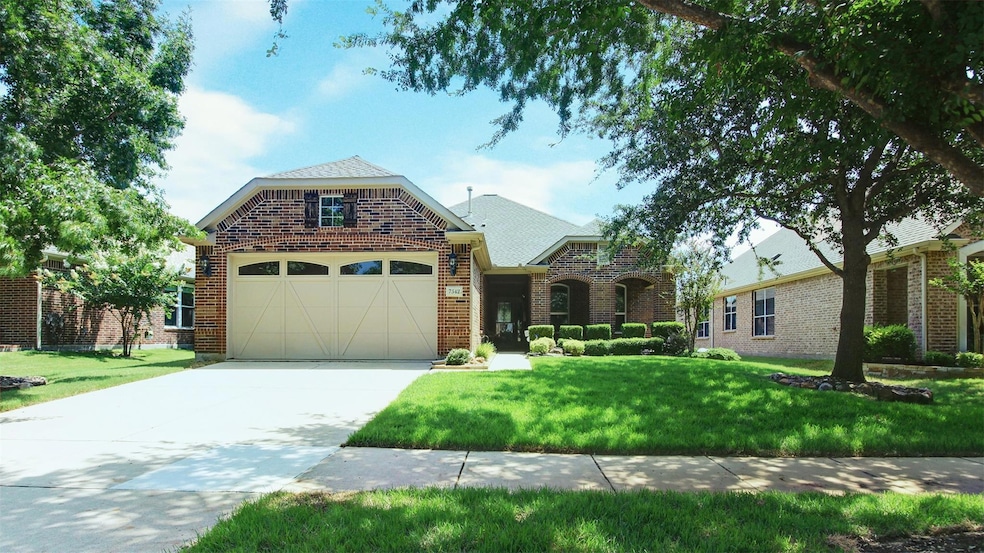 Beautifully landscaped front yard. New hearty gras