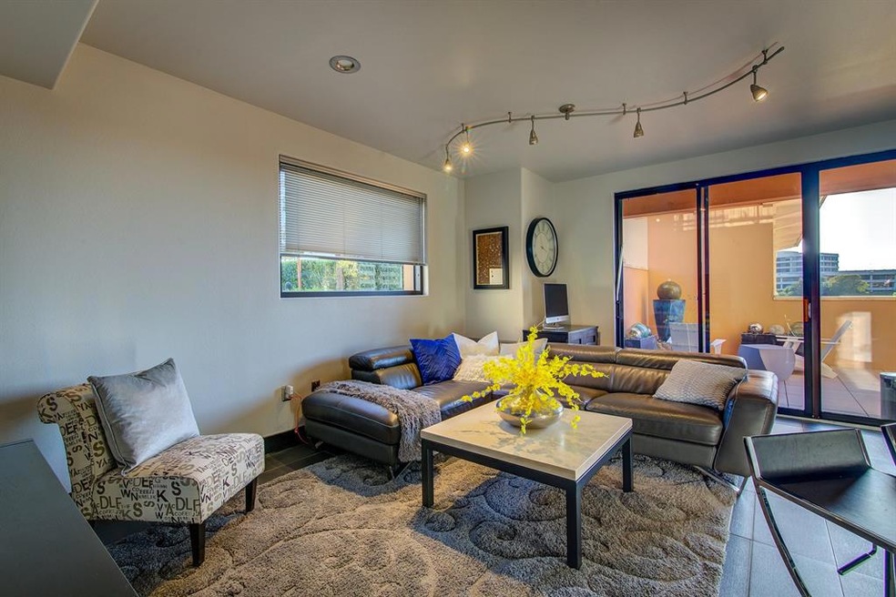 Living room with view out to pool area.