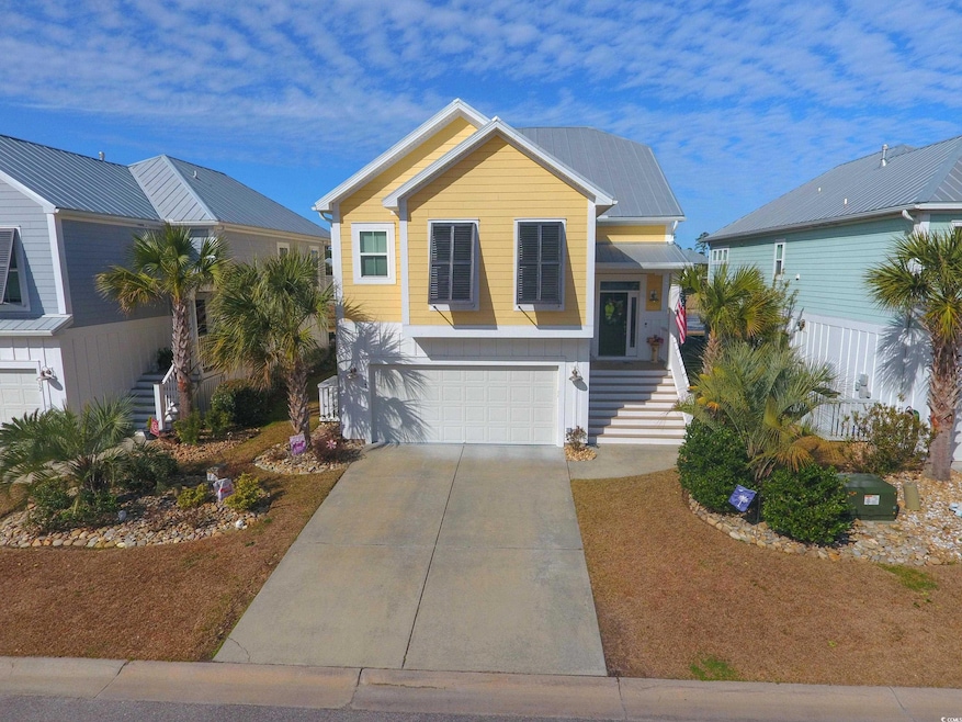 View of front of property with a garage, concrete 