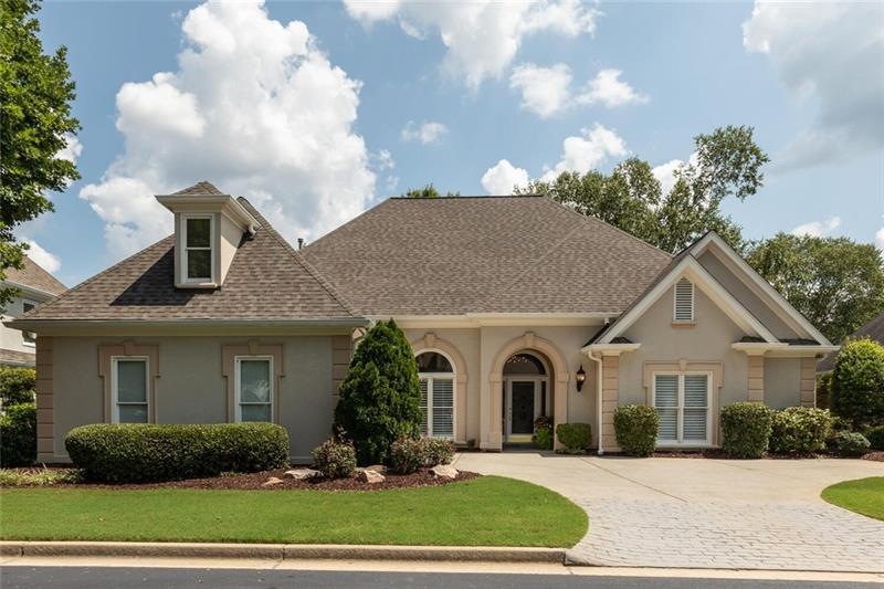 Front of the home with courtyard entry garage.