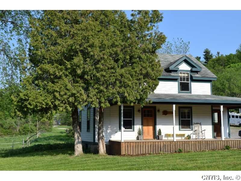 Exterior Front. Shady, airy porch awaits the eveni