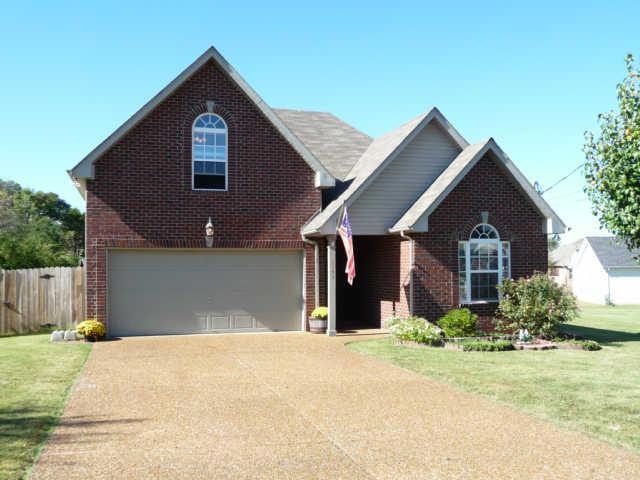 1103 Saddle Creek Drive has a brick front and siding on three sides.