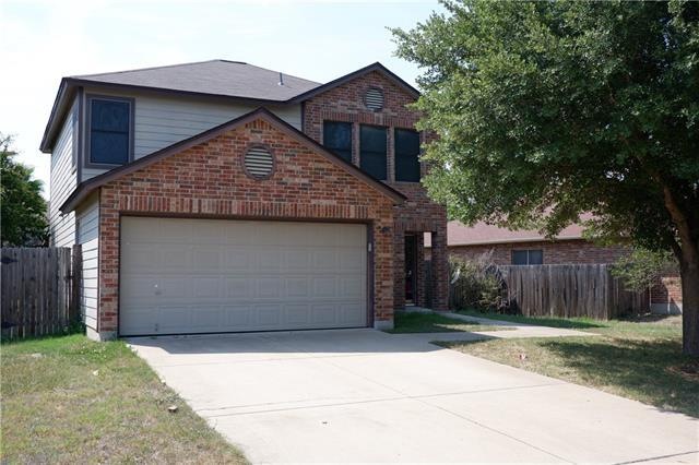 Front view, 2 car garage with a garage opener