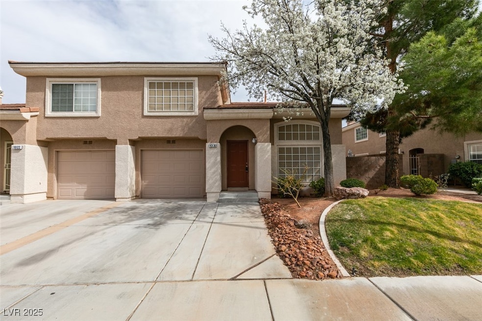 View of front of property with an attached garage,