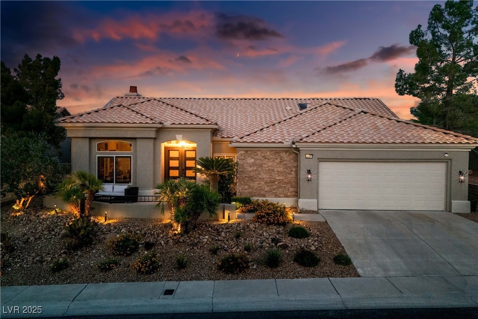 Mediterranean / spanish-style home with an attache