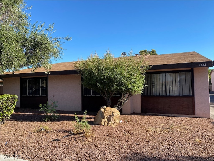 Ranch-style house with stucco siding