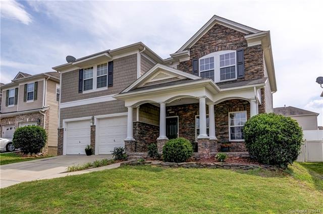 Gorgeous home with covered front porch, stacked st
