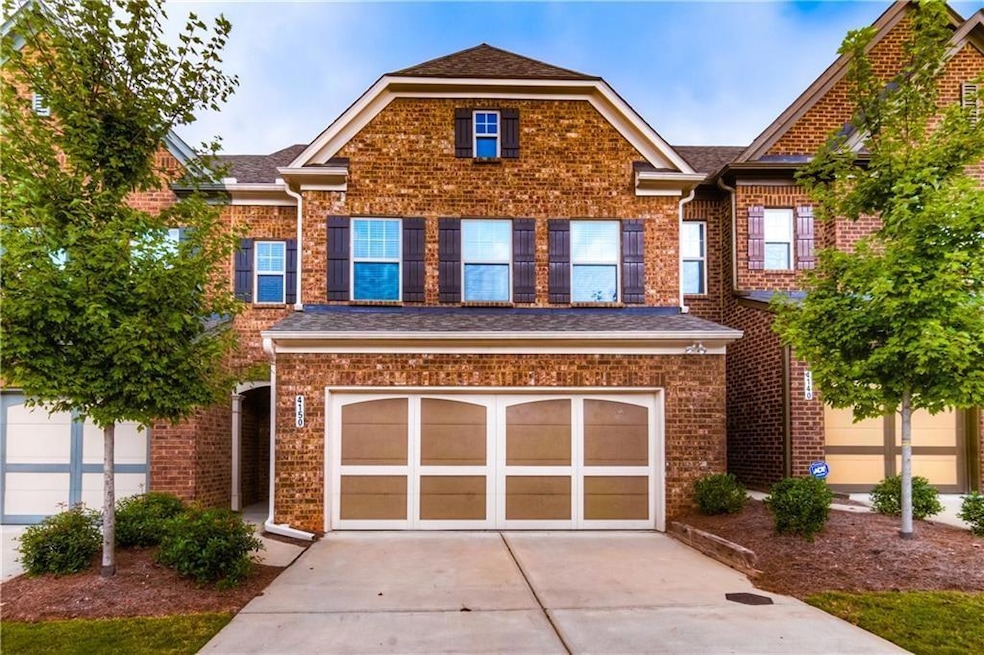 View of front facade with a garage, concrete drive