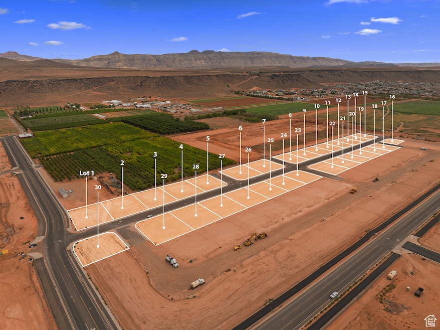 Aerial view of sparsely populated area featuring a mountainous background