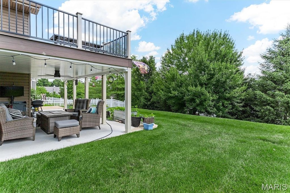 Ranch-style house featuring brick siding, a front yard, concrete driveway, and a garage