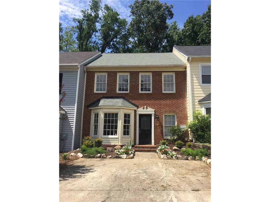 Brick front townhouse with plenty of parking.
