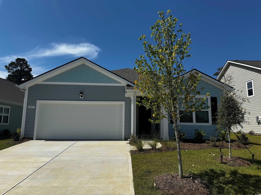 View of front of house featuring a garage and a fr