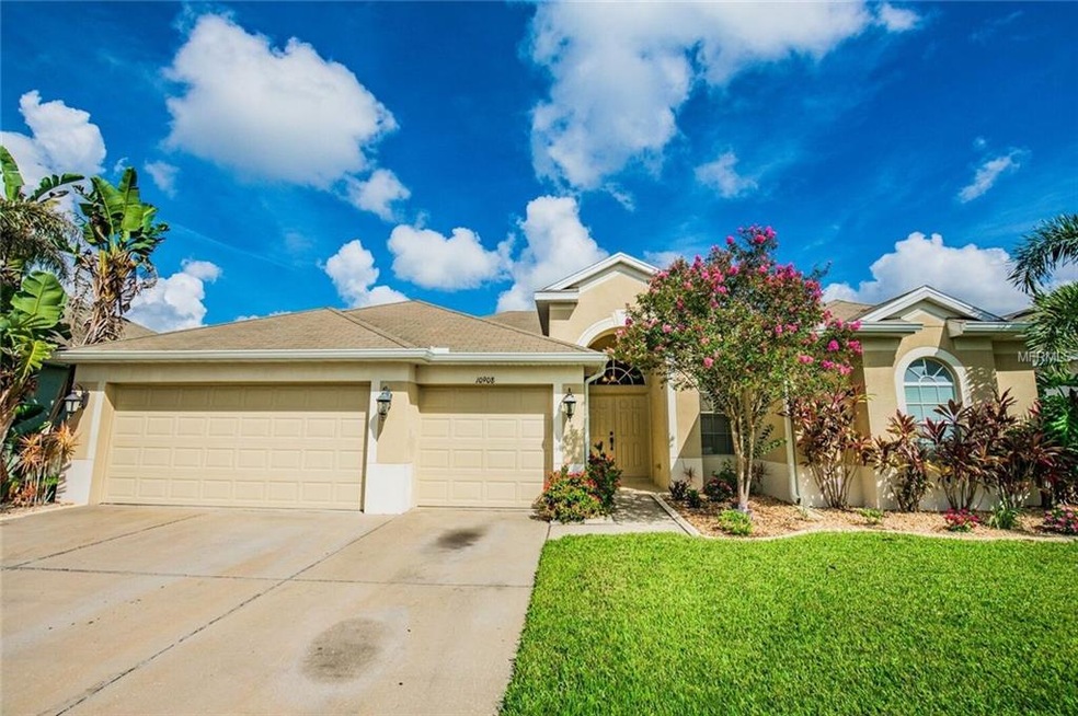 Front elevation with mature lush tropical landscap
