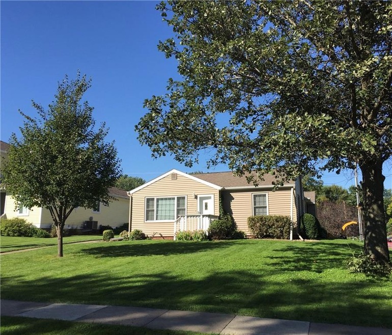 Beautiful corner lot - think Spring with this gree
