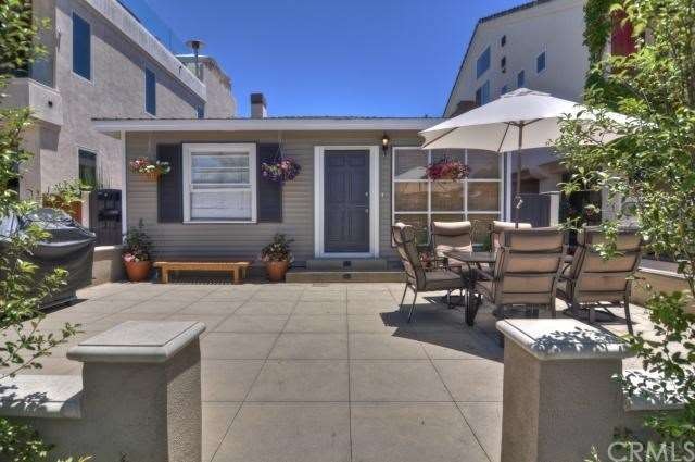 Beach cottage with dutch door and spacious patio. 