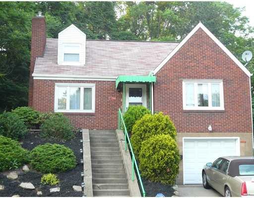 Exterior Front. All brick Cape Cod style home.  Ve