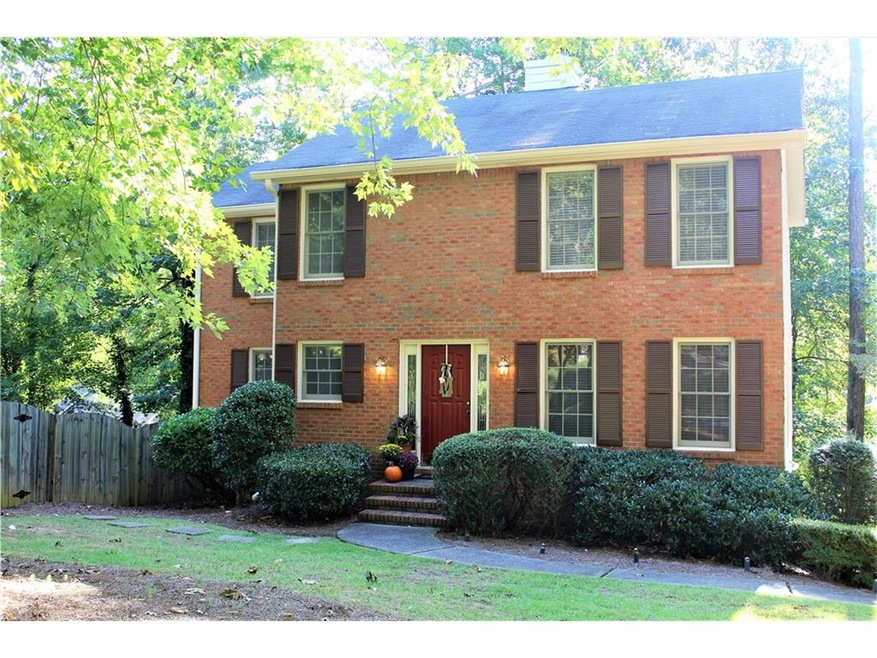 East Cobb tradition home located on a large wooded
