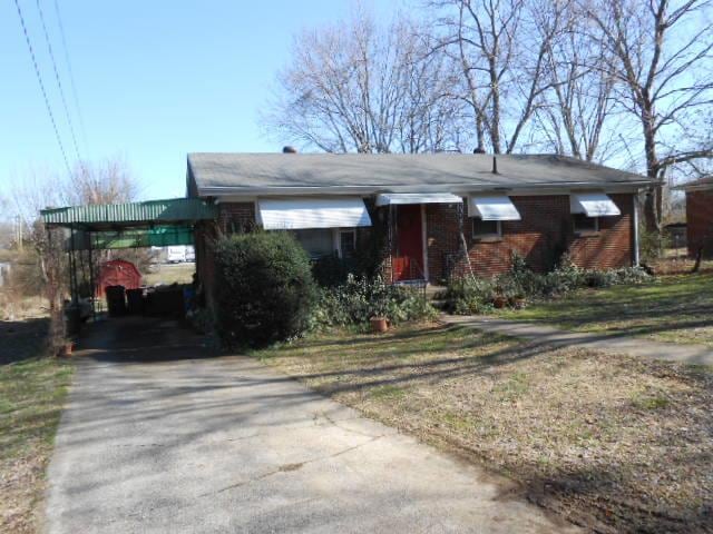 FRONT SHOWING CARPORT