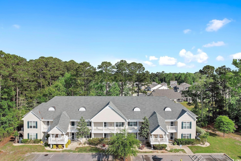 Exterior space with uncovered parking and a balcon
