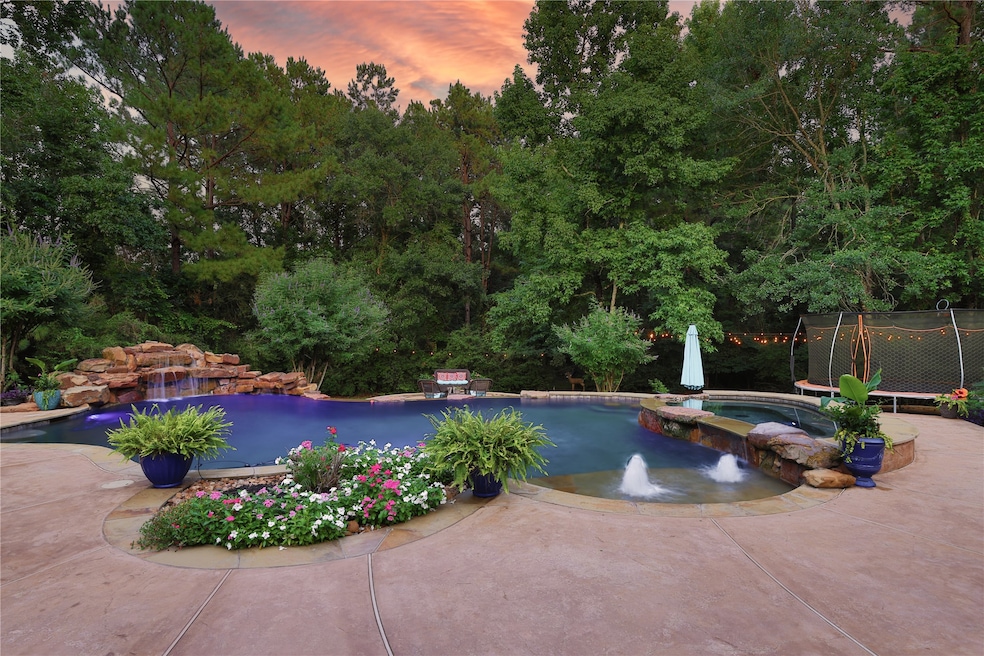 This backyard oasis features a stunning pool with