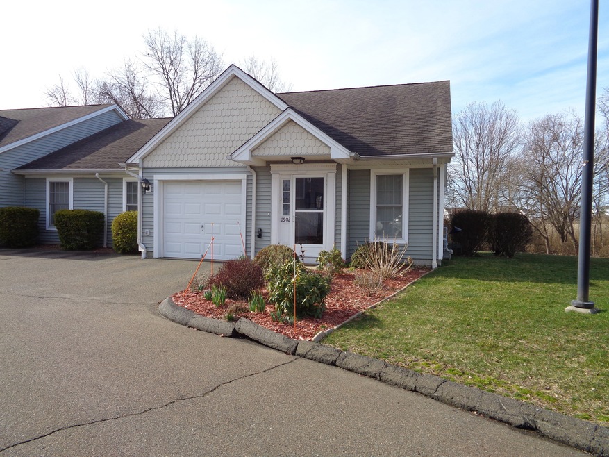 Front entrance with garage to left.