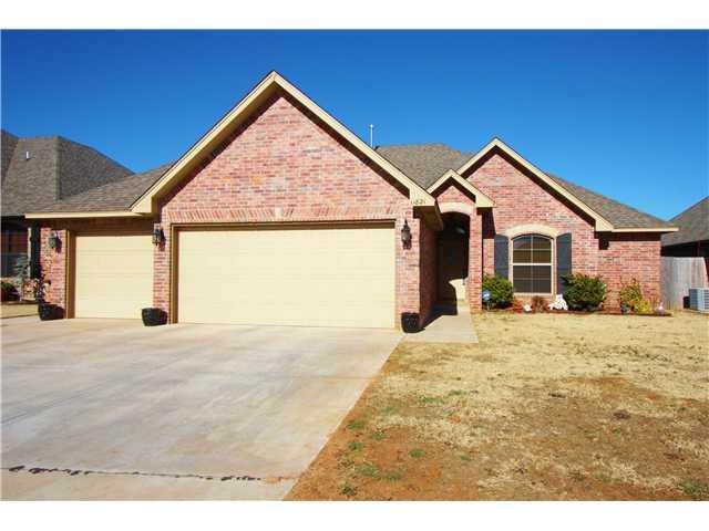 Exterior Front. 3 car Garage with Storm Shelter