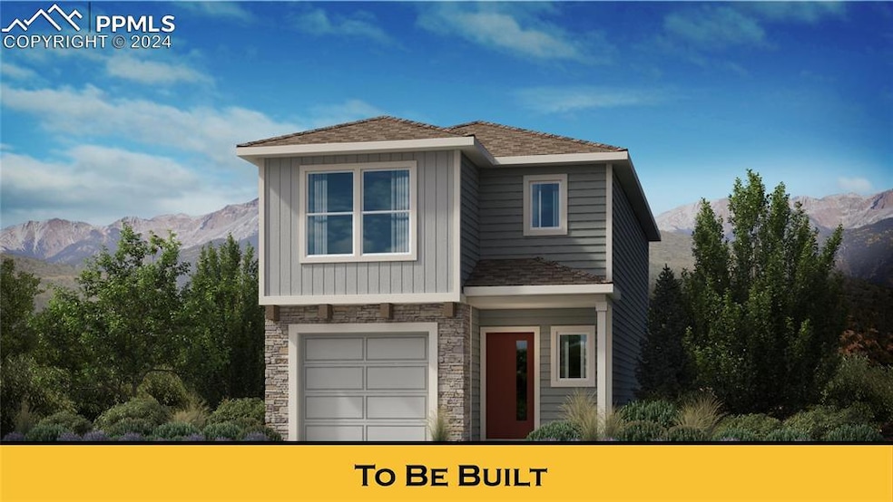 View of front of home with a garage and a mountain