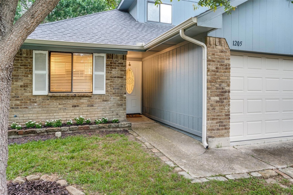 Doorway to property featuring a garage