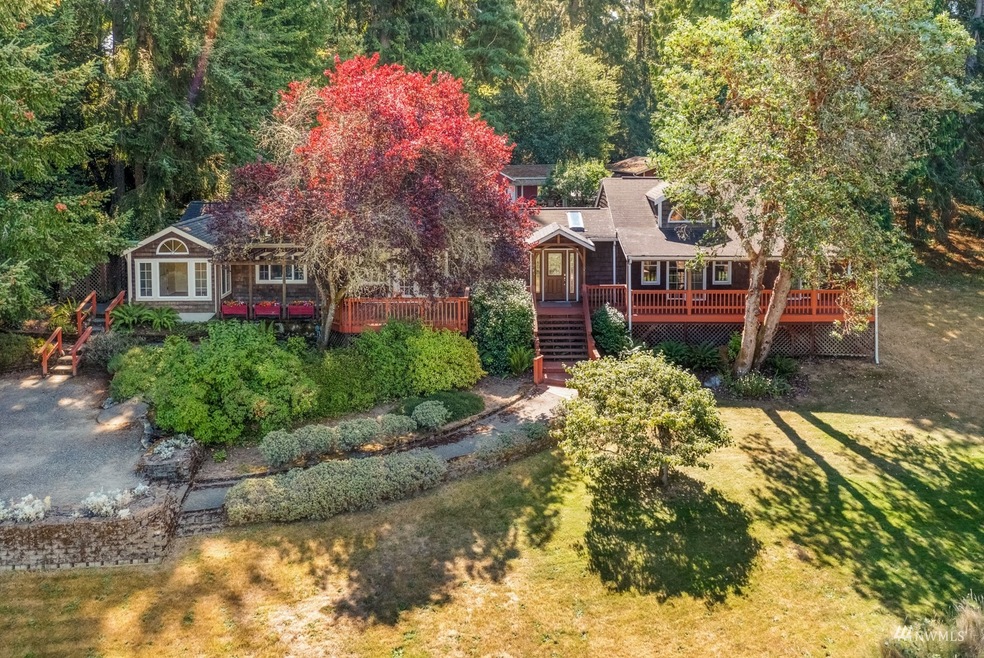 Enjoy the setting sun over the Southern Puget Sound from this sprawling West facing historical Steilacoom Rambler.