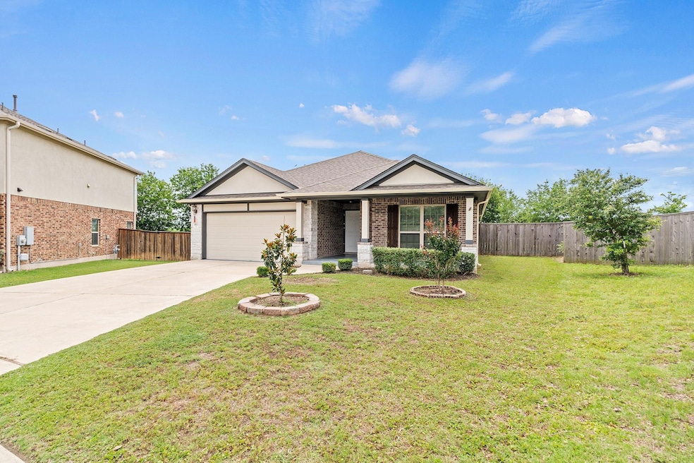 Single story home with an attached garage, drivew