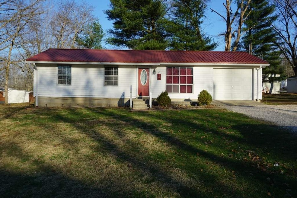 Front view of the home shows the large front yard 