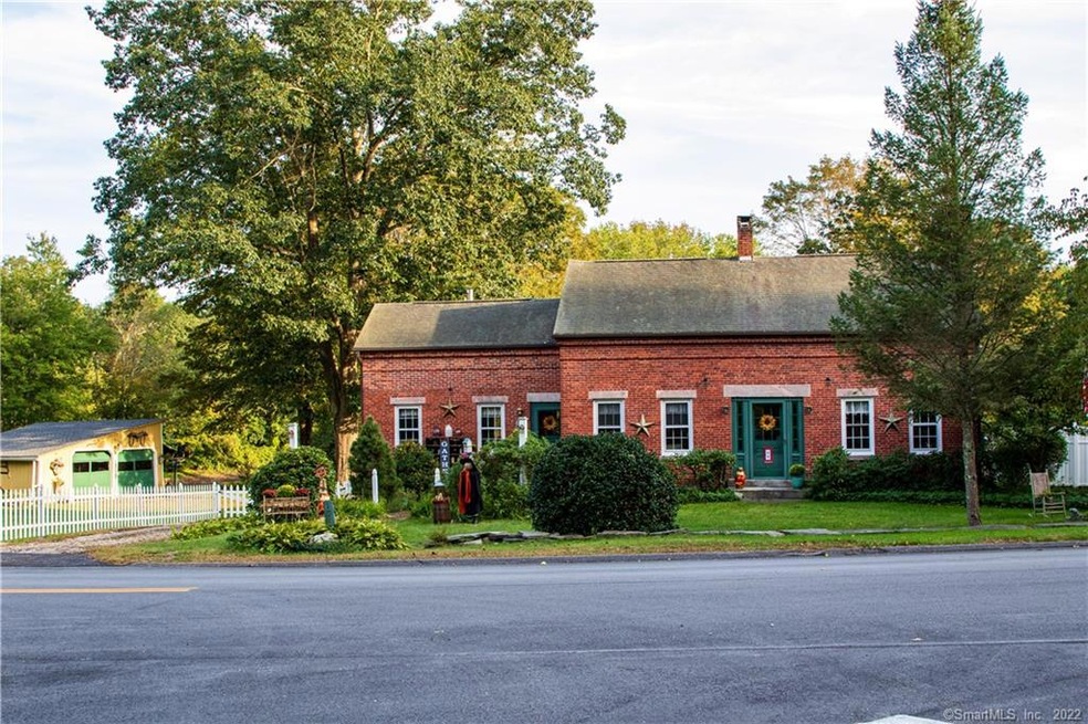 Front view of the charming, brick Main House