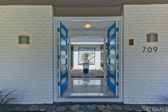 This entrance with covered porch area, terrazzo fo