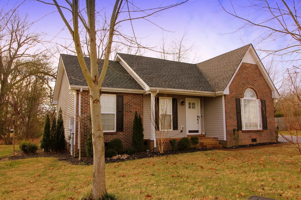 Pristine landscaping & additional trees that will wow you in the Spring...