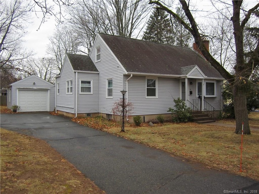 Front view of 82 Coleman Road with detached garage