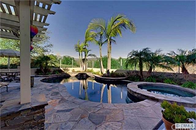 Another look at the back yard with views of hills,