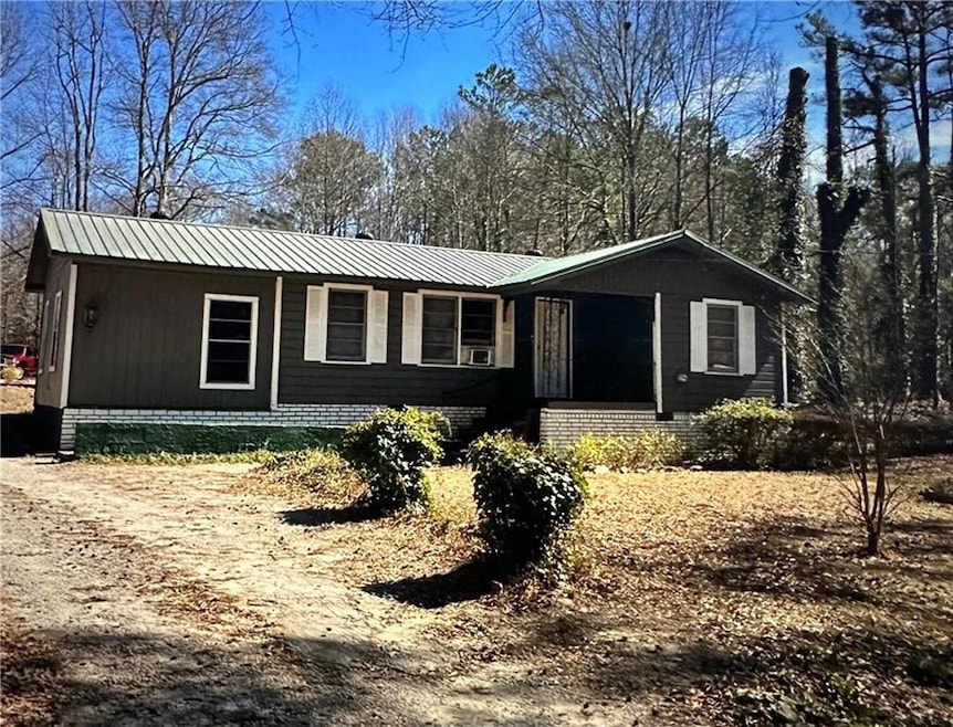 View of front of home featuring a metal roof