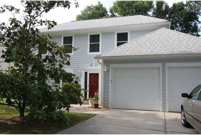 Exterior Front. New garage doors with electric ope
