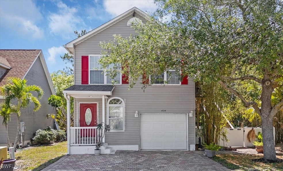 Traditional-style house with a garage and decorati