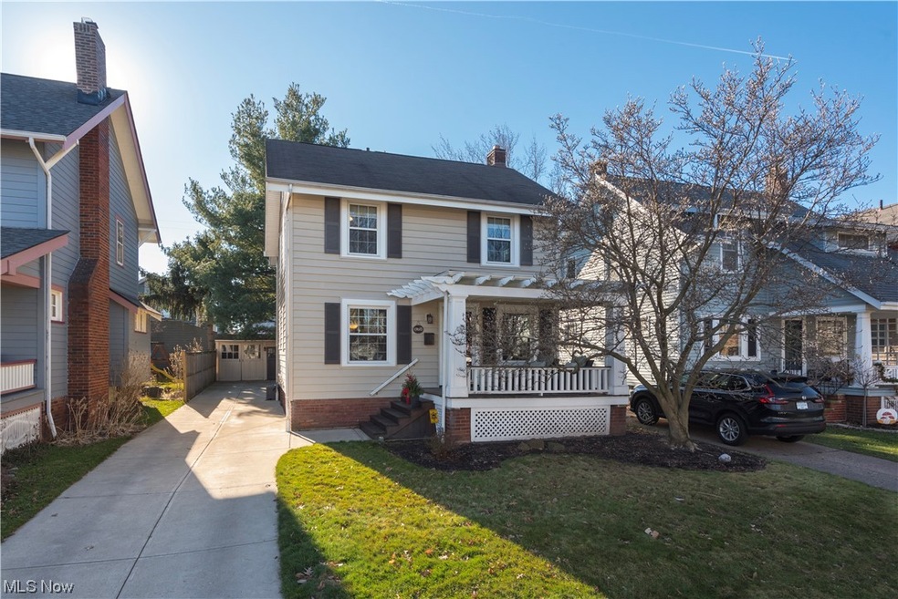 View of front of home featuring a front lawn and a porch