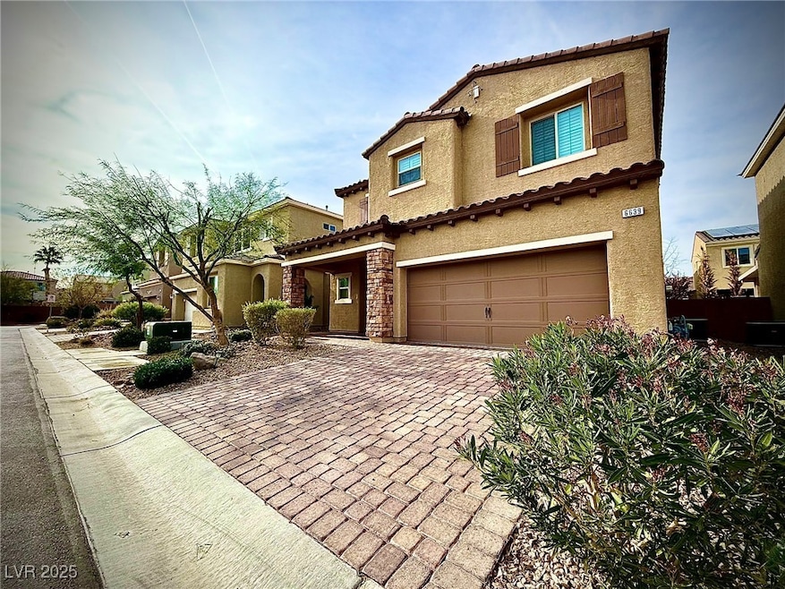 Mediterranean / spanish-style home with a garage,