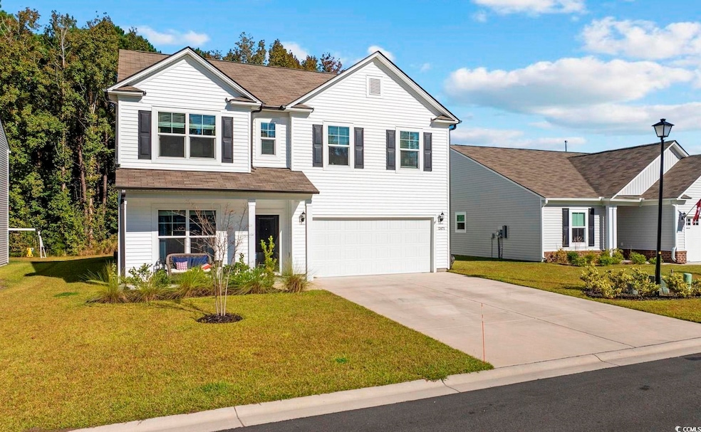 View of front facade featuring a front yard and a 