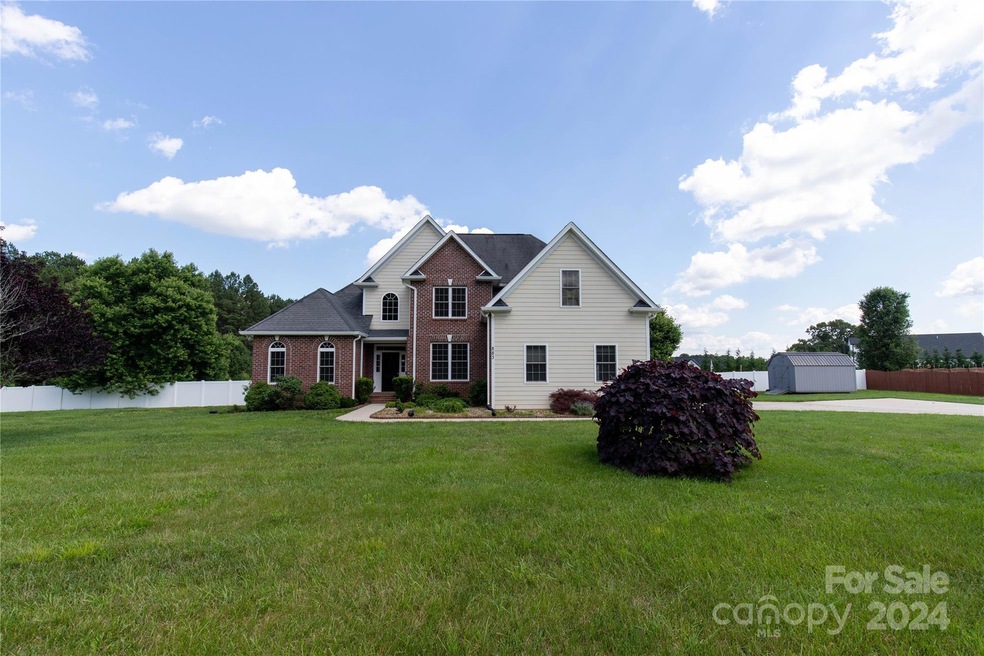 Custom Home accented by Brick and Cement Board Siding