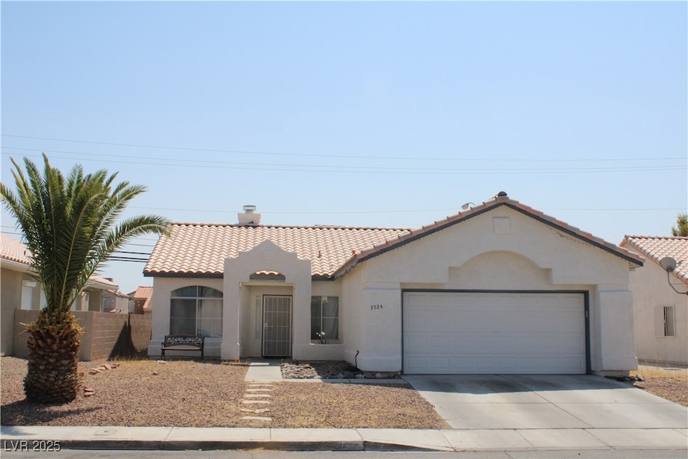 Mediterranean / spanish-style home with a tile roo